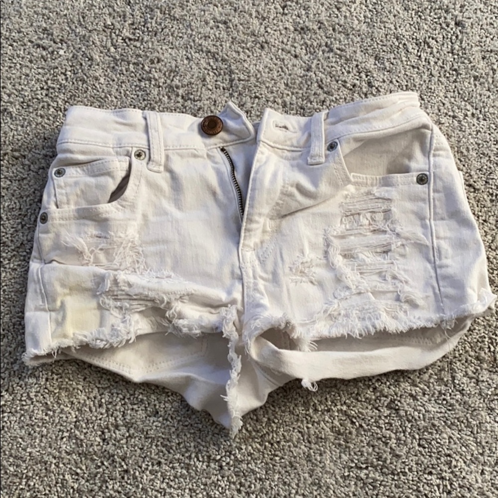 White ripped jean shorts